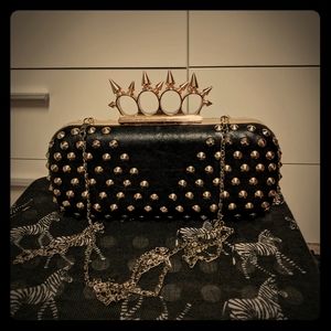 Edgy studded black leather clutch